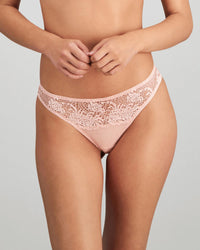 Model wears Adoration Thong in SILVER PINK. On body front view
