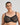 Model wears Delicate Lace Underwire Bra in BLACK/CREAM TAN. On body front view