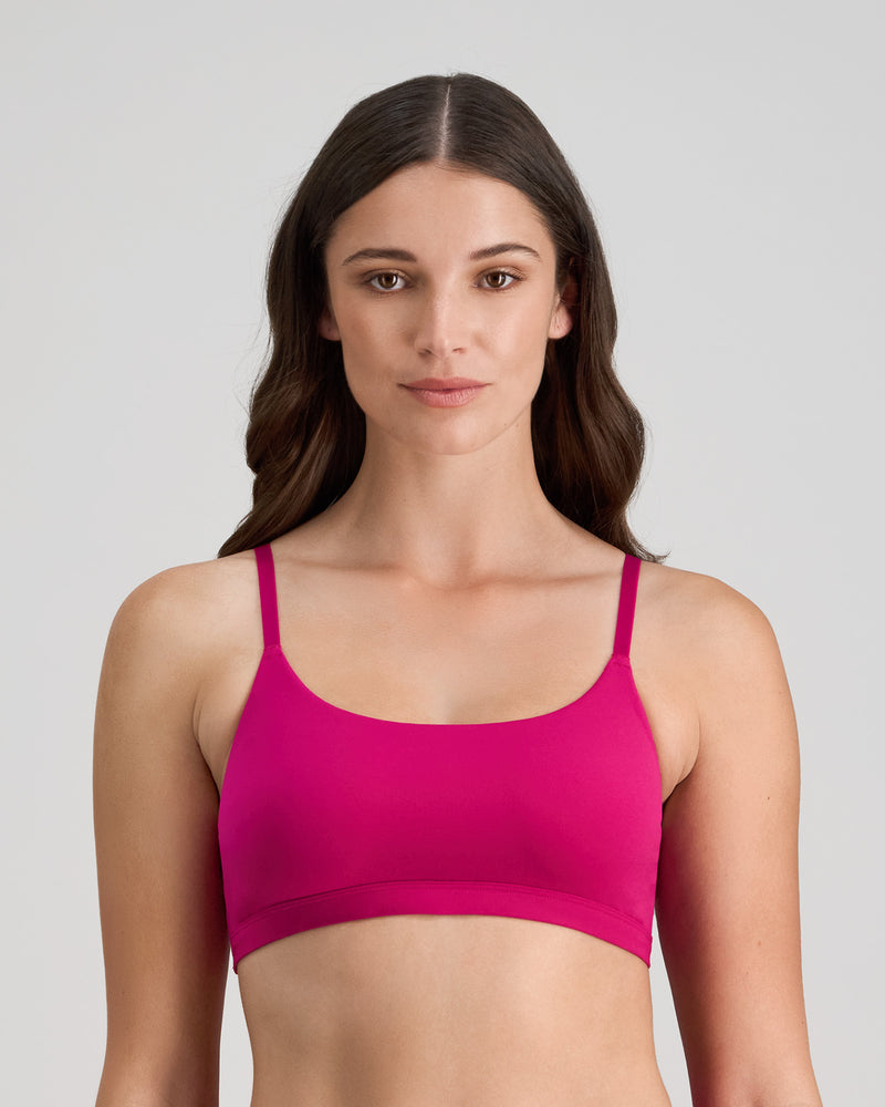 Model wears Extra-Ordinary Crop Top in FANTASY FUCHSIA. On body front view