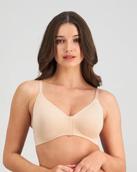 Model wears Comfit Collection Wire Free Front Opening Bra in LATTE. On body front view