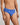Model wears Cotton Stretch Mens Brief in SURF THE WEB STRIPE. On body side view