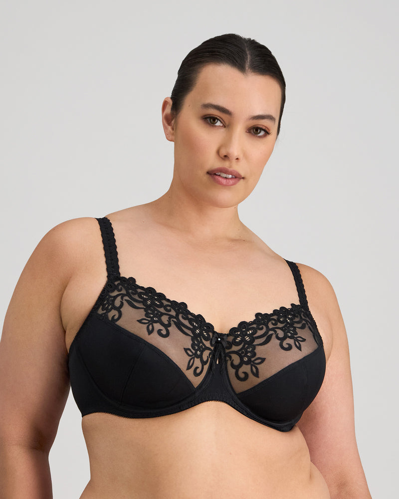 Model wears Coral Underwire Bra in BLACK. On body front view