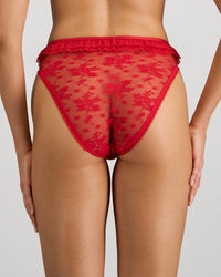 Model wears Tinsel Tease High Cut Brief in SALSA. On body back view