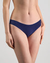 Model wears Extra-Ordinary Bikini Brief in Medieval Blue. On body side view