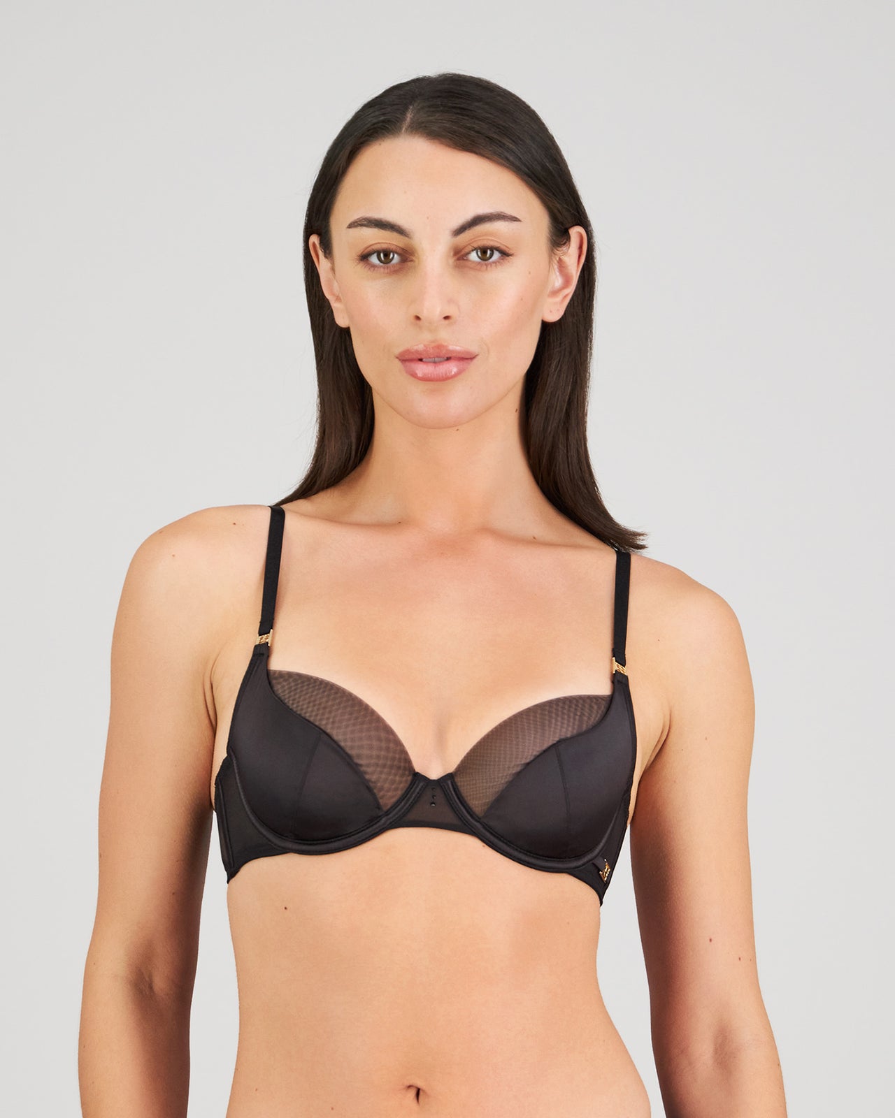 Model wears Sheer Impact Contour Bra in BLACK. On body front view
