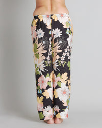 Model wears Mihika Sleeping Long PJ Pant in MID-SUMMER PRINT. On body back view
