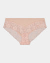 Model wears Lace Trim Brazilian in LATTE. On body front view