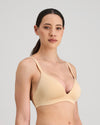 Model wears Simply Seamless Wire Free Bra in Nude. On body side view