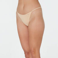 Model wears Clemence Thong in AMERICAN NUDE. On body side view