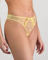 Model wears Sunlit Thong in LEMON MERINGUE. On body side view