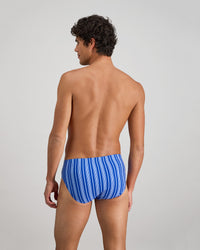 Model wears Cotton Stretch Mens Brief in SURF THE WEB STRIPE. On body back view