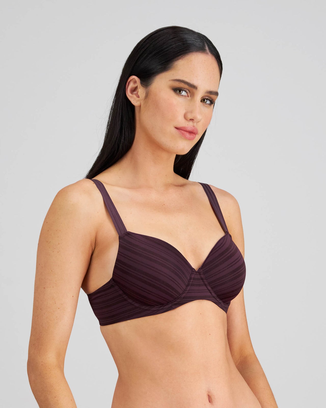 Model wears Rita Contour Bra in PLUM PERFECT. On body side view
