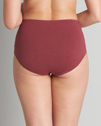 Model wears Embrace Full Brief in OXBLOOD RED. On body back view