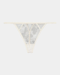 Olivia Luxe Thong in CHAMPAGNE. Flat lay front view