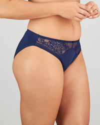 Model wears Eternal Bikini in Medieval Blue. On body side view