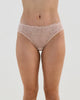 Model wears Lacey Bikini in LATTE. On body front view