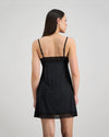Model wears Understatement Slip in BLACK. On body back view