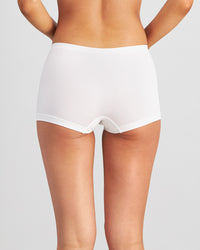 Model wears Simply Seamless Boyshort in WHITE. On body back view