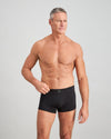 Model wears High Tech Cotton Mens Trunk in BLACK. On body front view