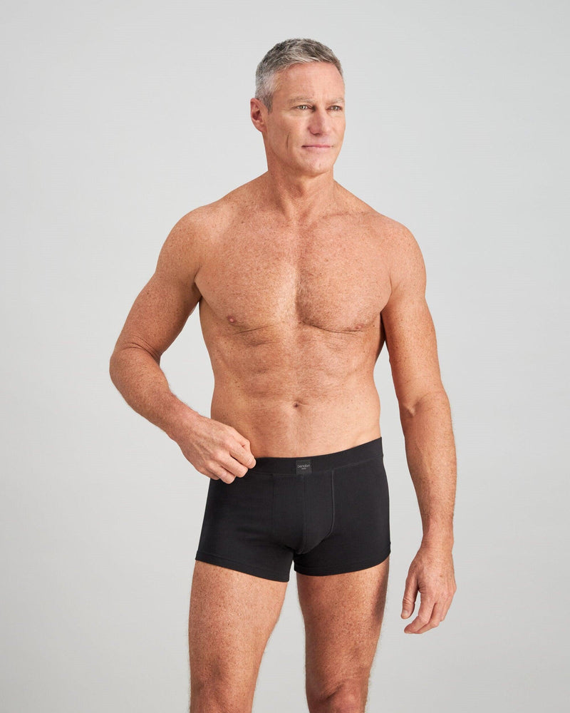 Model wears High Tech Cotton Mens Trunk in BLACK. On body front view