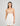 Model wears Eros Chemise in SUGAR. On body front view