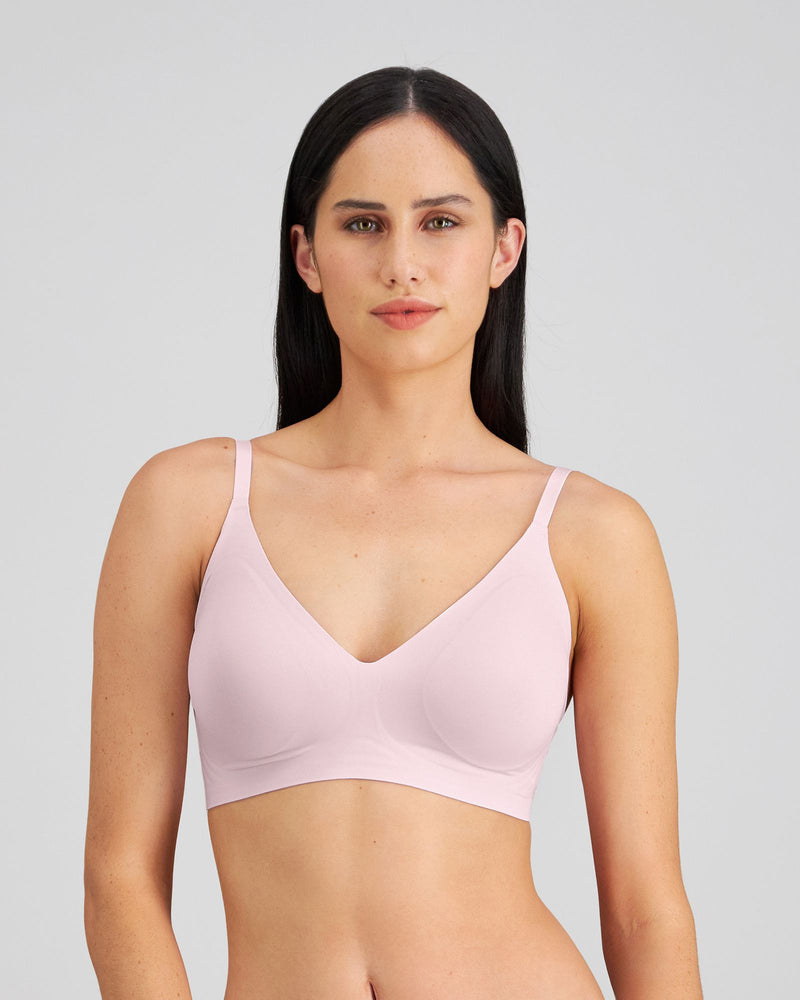 Model wears Comfit Collection Wire Free Bra in FESTIVAL BLOOM. On body front view