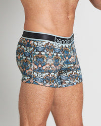Model wears Retros Print Mens Trunk in TWISTED CLASSICS. On body side view