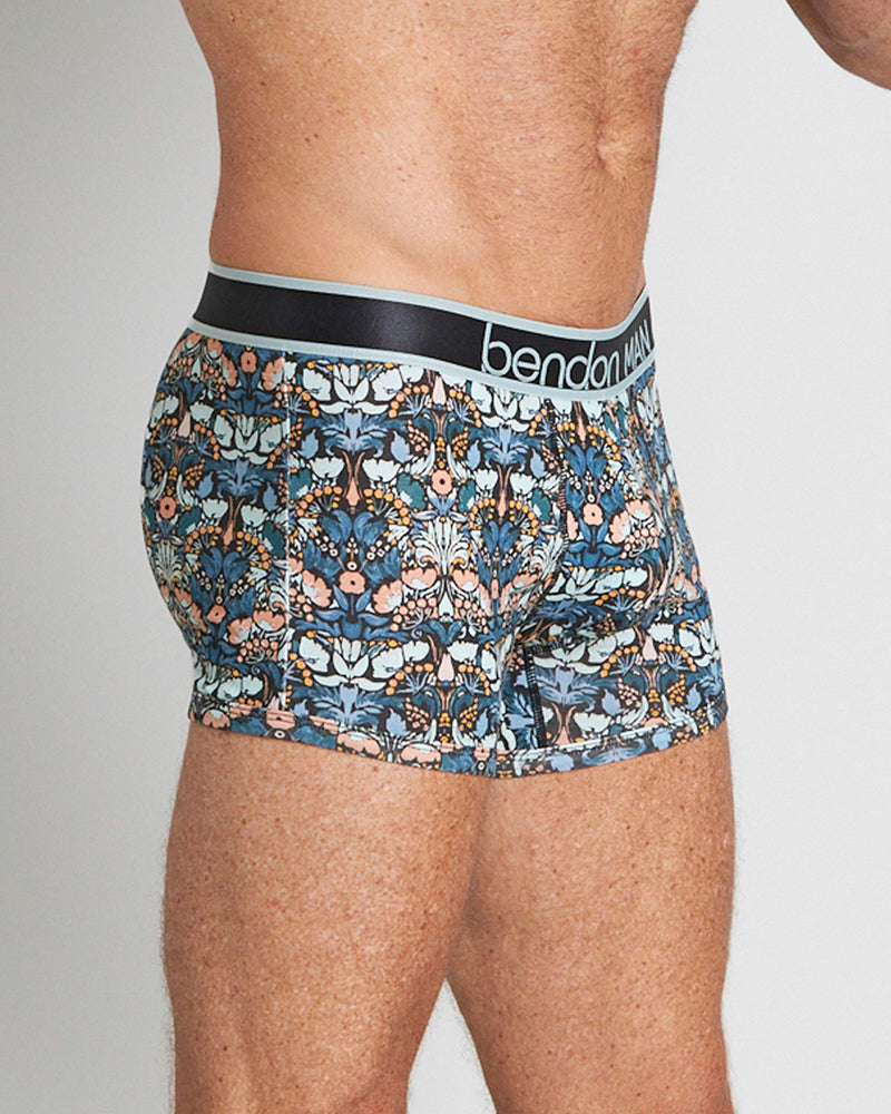 Model wears Retros Print Mens Trunk in TWISTED CLASSICS. On body side view