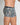 Model wears Retros Print Mens Trunk in TWISTED CLASSICS. On body side view