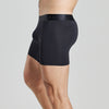 Model wears Bamboo Mens Trunk in BLACK. On body side view