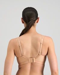 Model wears Stamina Wire Free Bra in LATTE. On body back view
