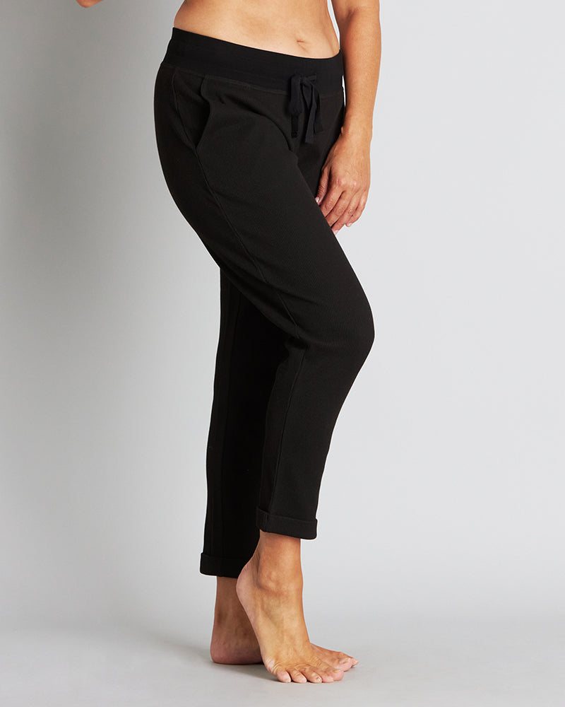 Model wears Mihika Sleeping Jogger in BLACK. On body side view