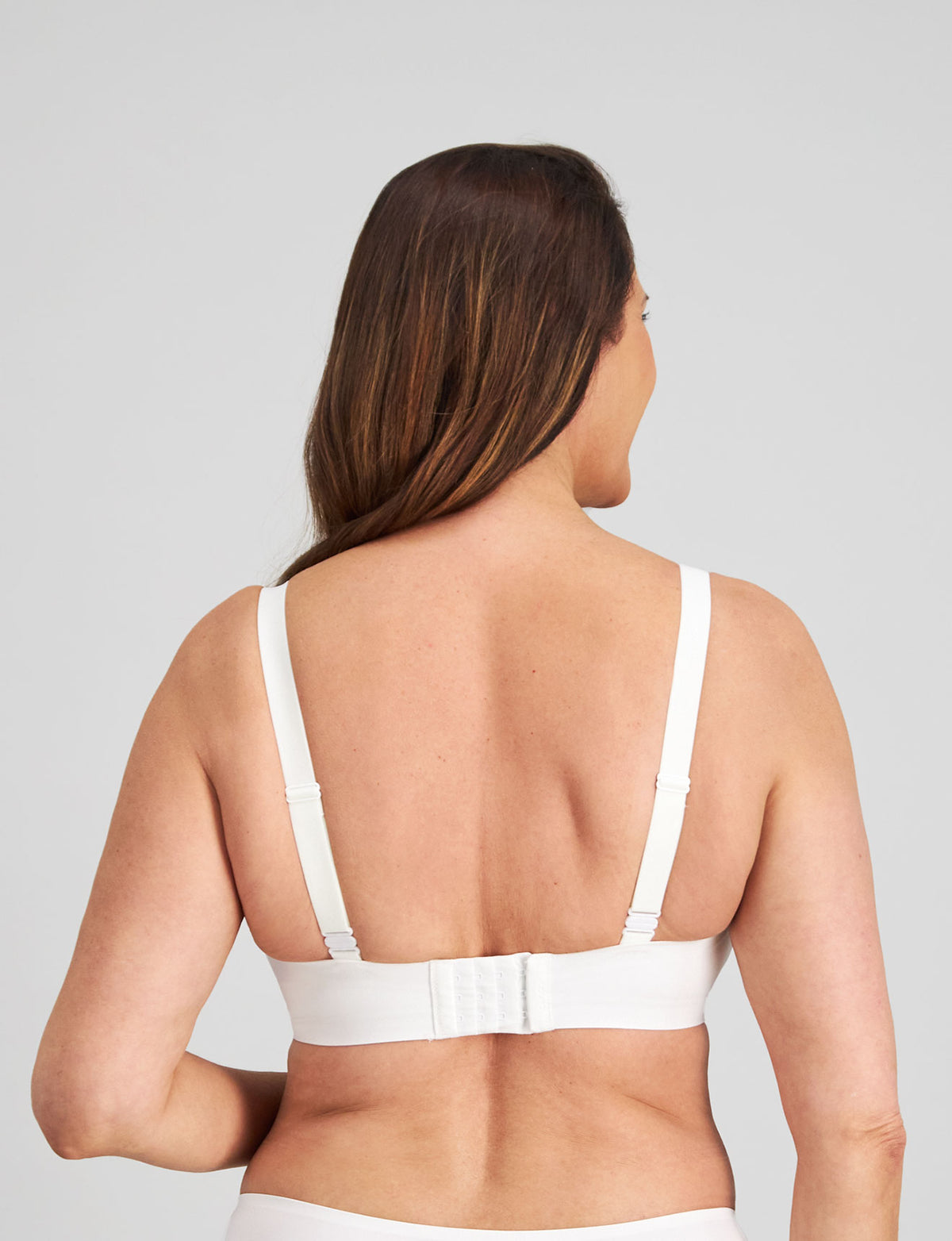 Model wears Comfit Collection Wire Free Bra in WHITE. On body back view