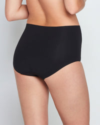 Model wears Bamboo Bodywear Full Brief in BLACK. On body back view