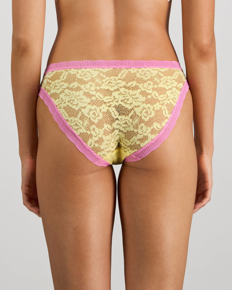 Model wears Leo Bikini in LEMON/FUCHSIA PINK. On body back view