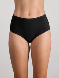 Model wears Extra-Ordinary Full Brief in BLACK. On body front view
