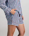 Model wears Cabana Stripe Short Pj in COOL BLUE. On body side view