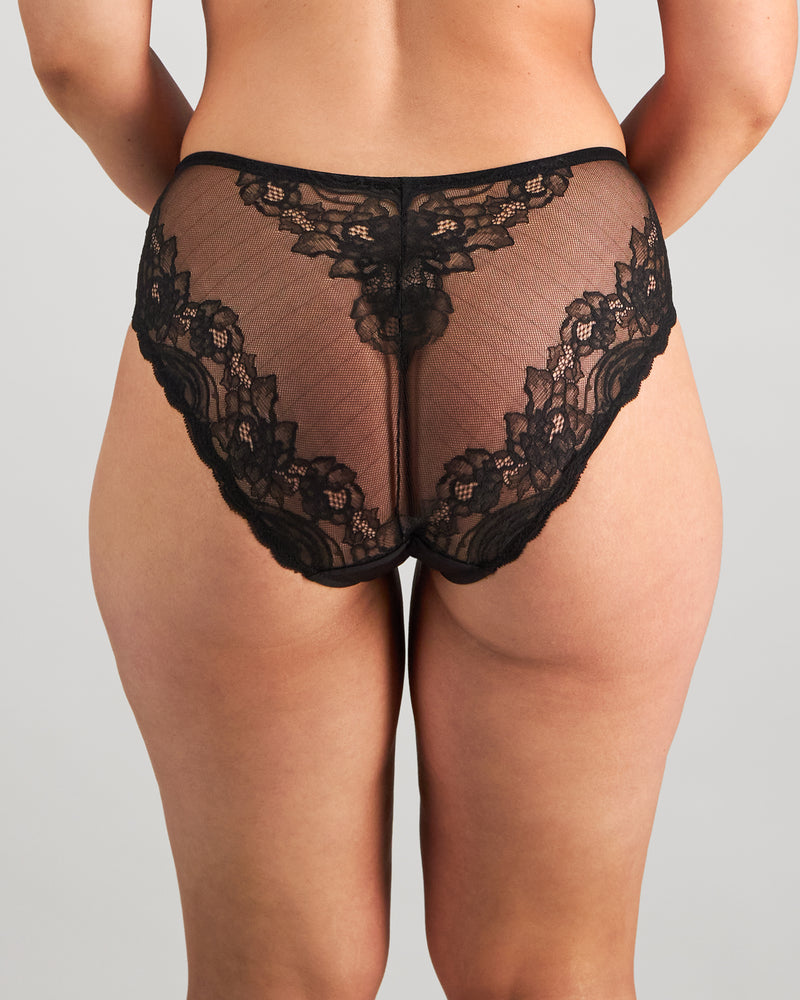 Model wears Intrigue Midi in BLACK. On body back view