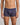 Model wears Bold Stripe Mens Trunk in PEACOAT/PLUM STRIPE. On body front view