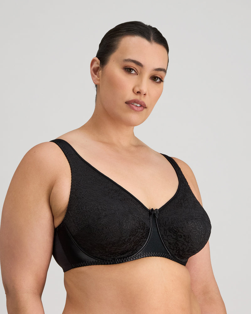 Model wears Charlotte Underwire Bra in BLACK. On body side view