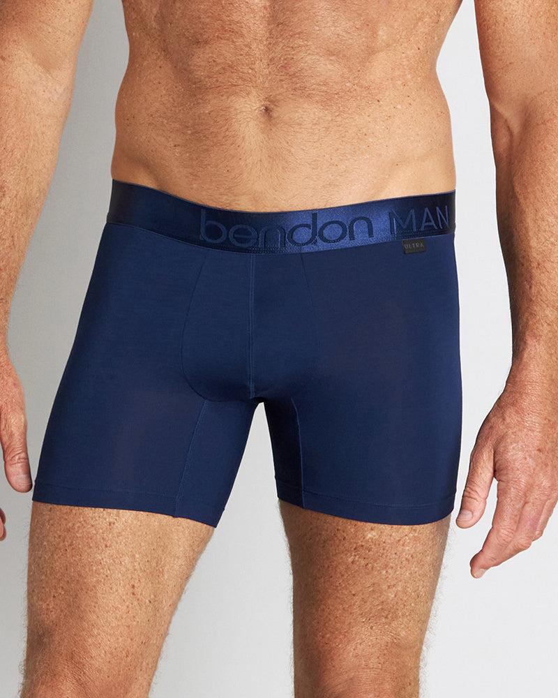 Model wears Bamboo Mens Trunk in Medieval Blue. On body front view