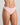 Model wears Seamless Soft Thong in ICY PINK. On body side view