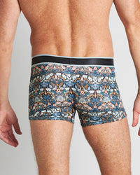 Model wears Retros Print Mens Trunk in TWISTED CLASSICS. On body back view