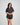Model wears Holly Short PJ in BLACK/CREAM. On body front view