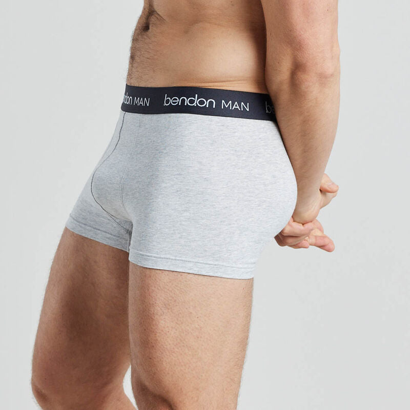 Model wears Organic Cotton Mens Trunk in LIGHT GREY MARL. On body side view