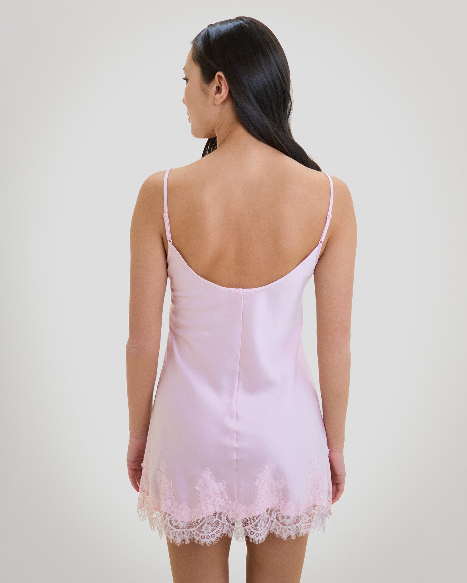 Model wears Sweet Indulgence Chemise in PALE LILAC. On body back view
