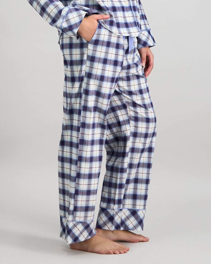 Model wears Cosy Flannel Long Pj Pant in NAVY BLAZER. On body side view