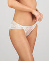 Model wears Dekota Devine Bikini in SUGAR. On body side view