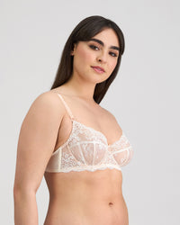 Model wears Sofia Underwire Bra in CAMEO. On body side view