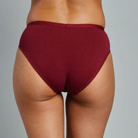 Model wears Body Cotton Bikini Twin Pack in RHUBARB/LINEN. On body side view